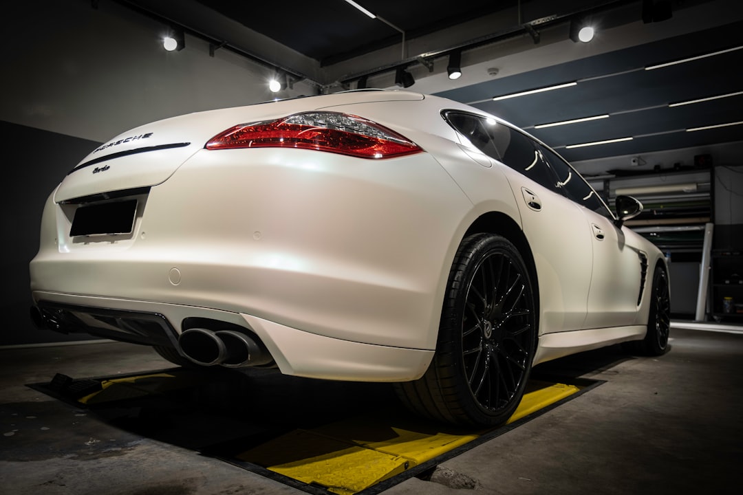 a-white-sports-car-parked-in-a-garage-qd77abbkfuo